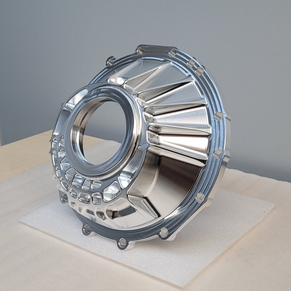 Metallic engine part on a gray background